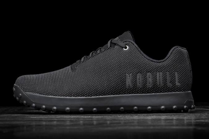 HH04B632 entraîneur de gazon noir Nobull femmes